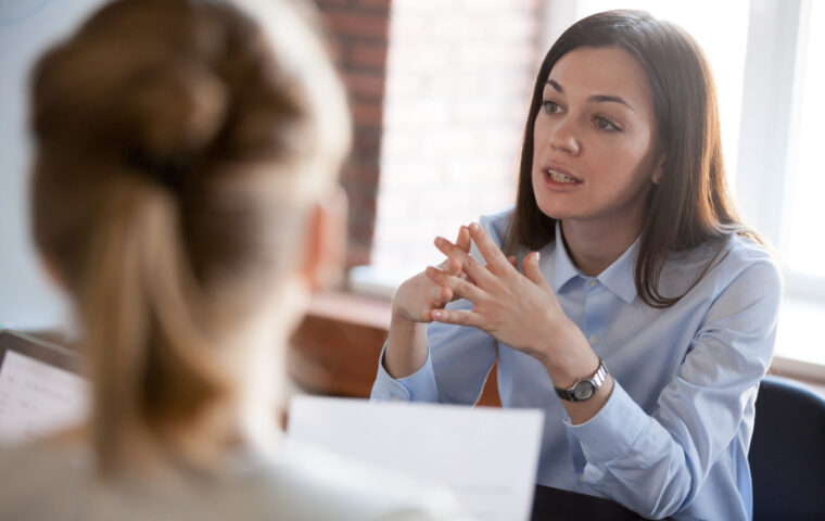 Confident,Focused,Businesswoman,,Teacher,Or,Mentor,Coach,Speaking,To,Business